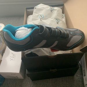 Two pairs of flywheel cycle shoes